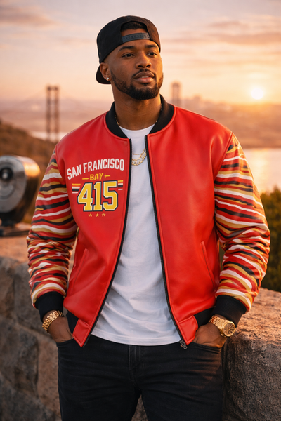 Man wearing a red San Francisco 49ers jacket with a sunset in the background