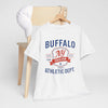 White t-shirt with 'Buffalo NY Excelsior Sports Athletic Dept.' text on a wooden chair.