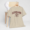 Beige t-shirt with 'Cleveland Oh' text on a hanger against a white background