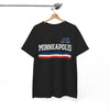 Navy blue t-shirt with 'Minneapolis' text on a hanger against a white background