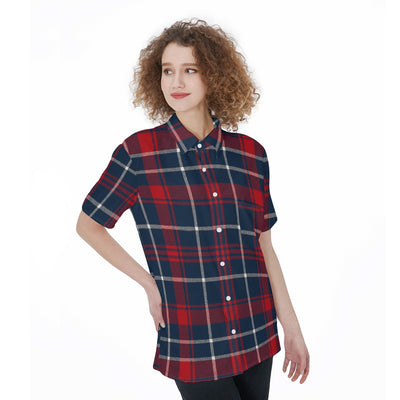 Woman wearing a red and blue plaid shirt on a white background