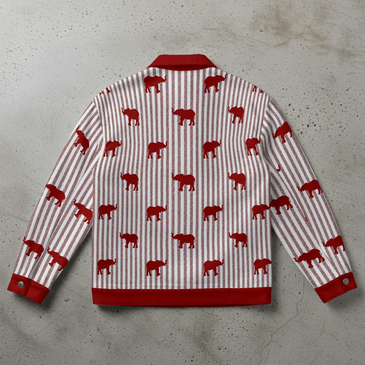 Red and white striped shirt with red bear pattern on a gray surface