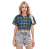 Woman wearing a blue and yellow plaid shirt with ripped denim shorts on a white background