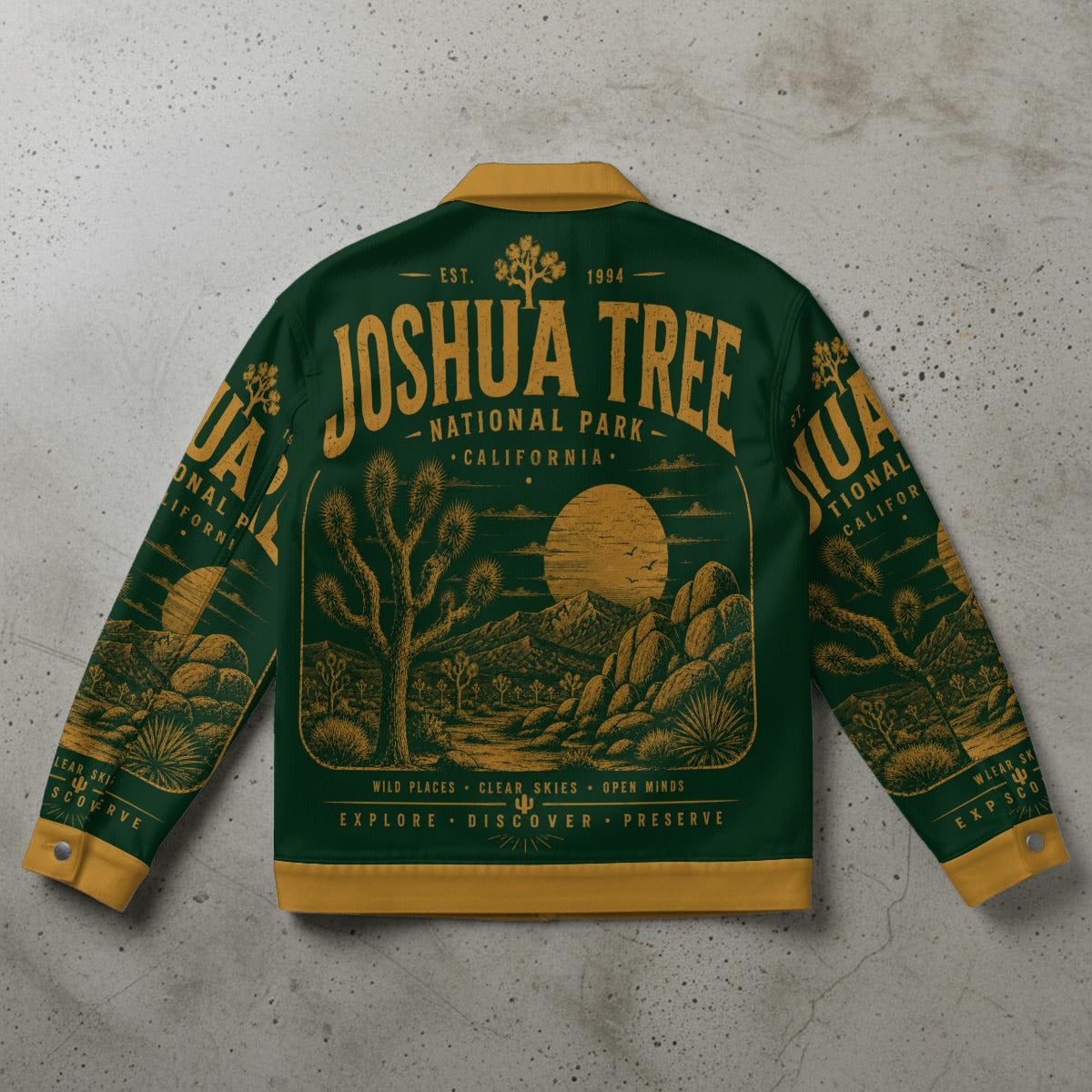 Green and yellow jacket with Joshua Tree National Park design on a gray surface