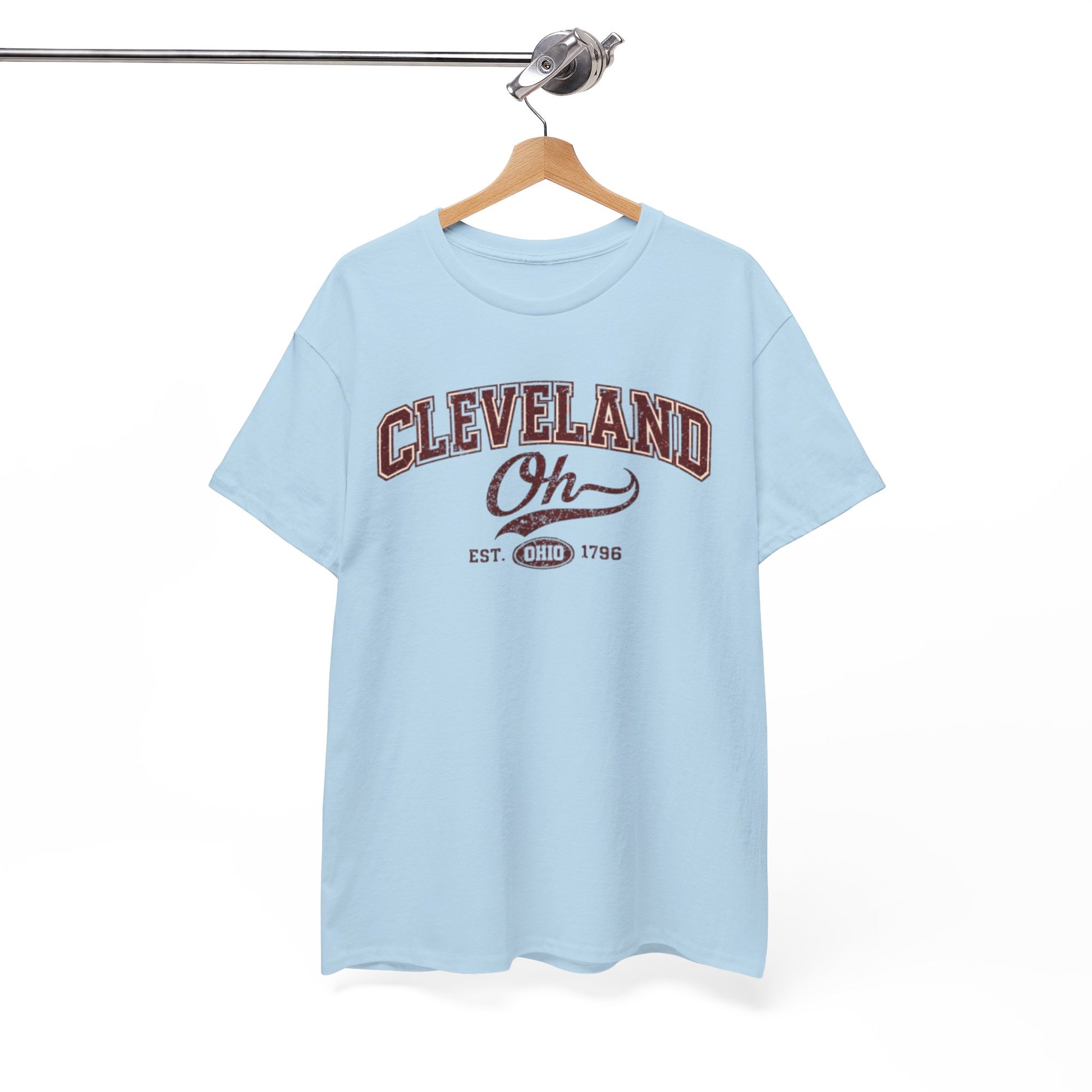 Light blue t-shirt with 'Cleveland Oh' text on a hanger against a white background