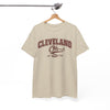 Beige t-shirt with 'Cleveland Oh' text on a hanger against a white background