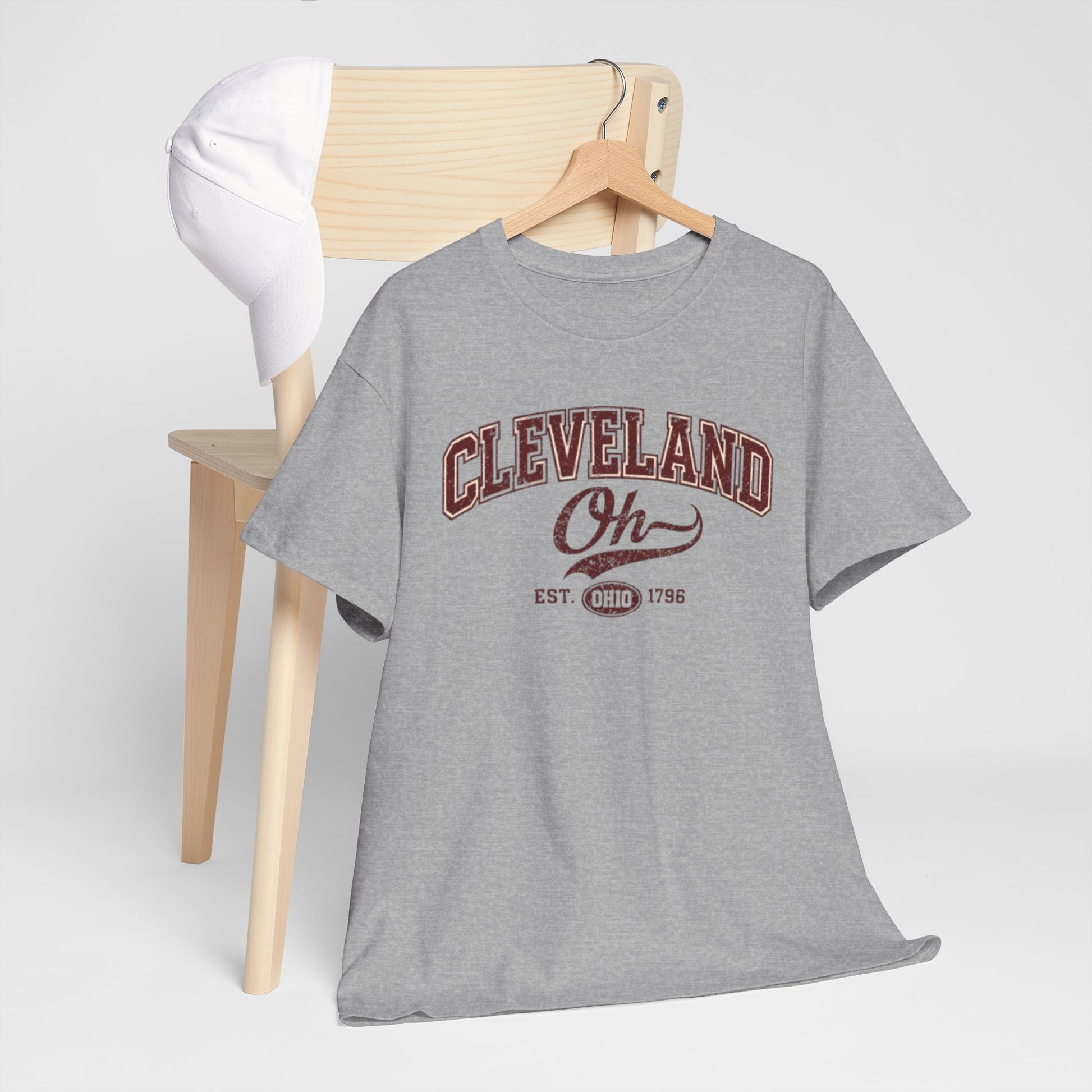 Gray t-shirt with 'Detroit Motor City' print on a wooden hanger against a white background