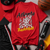 Red t-shirt with 'Atlanta Basketball' graphic, black shorts, black sneakers, Wilson basketball, and black cap on a colorful background.