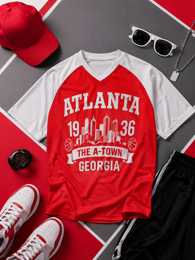 Red and white t-shirt with 'Atlanta 1936' design, surrounded by accessories on a red and gray checkered background.