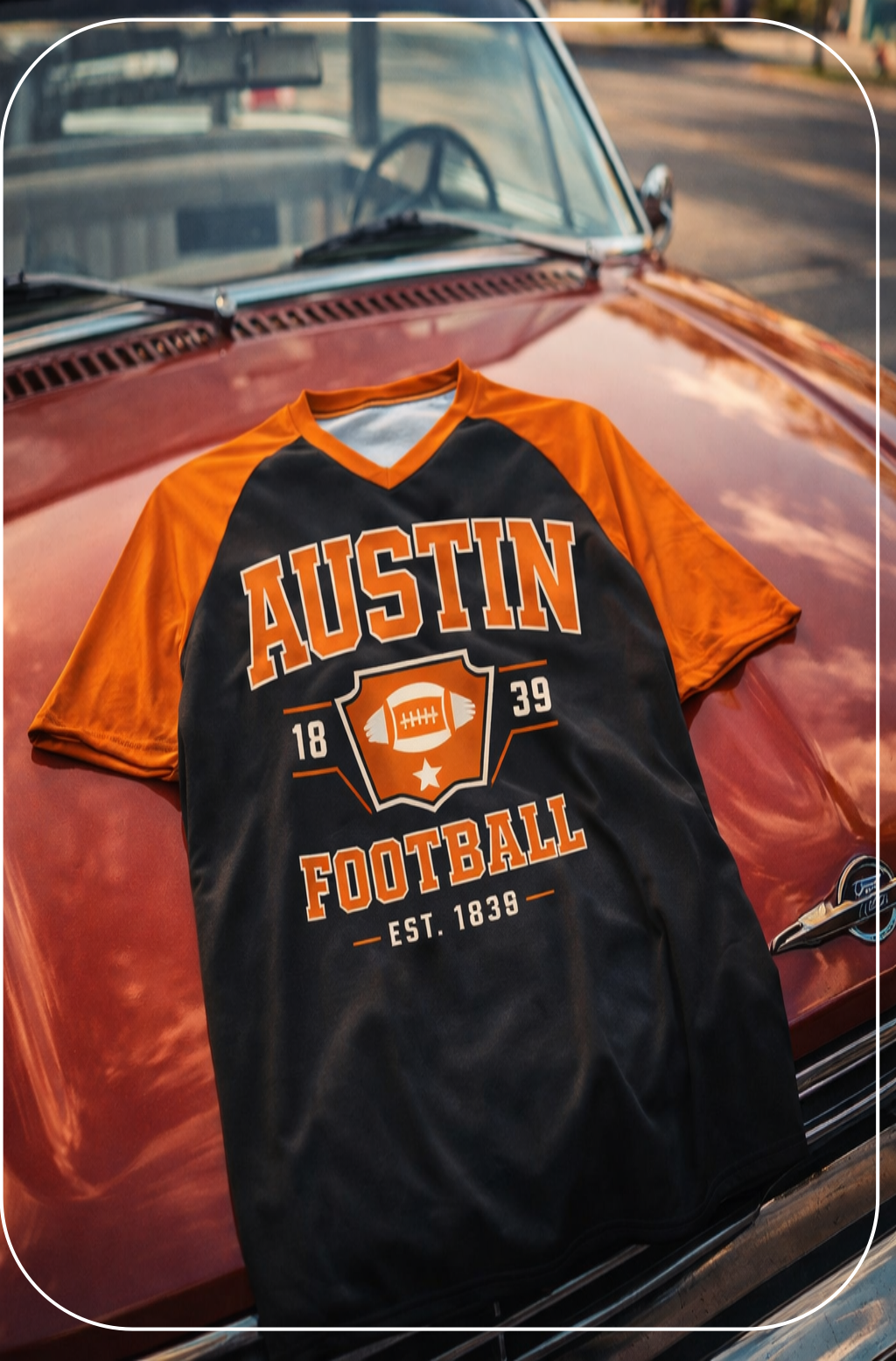 Black and orange 'Austin Football' t-shirt on a classic car