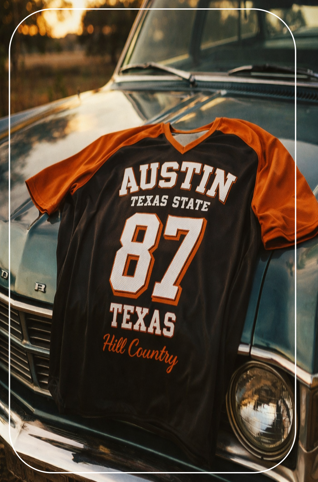 Black and orange sports jersey with 'Austin Texas State 87 Texas Hill Country' text on a vintage car.