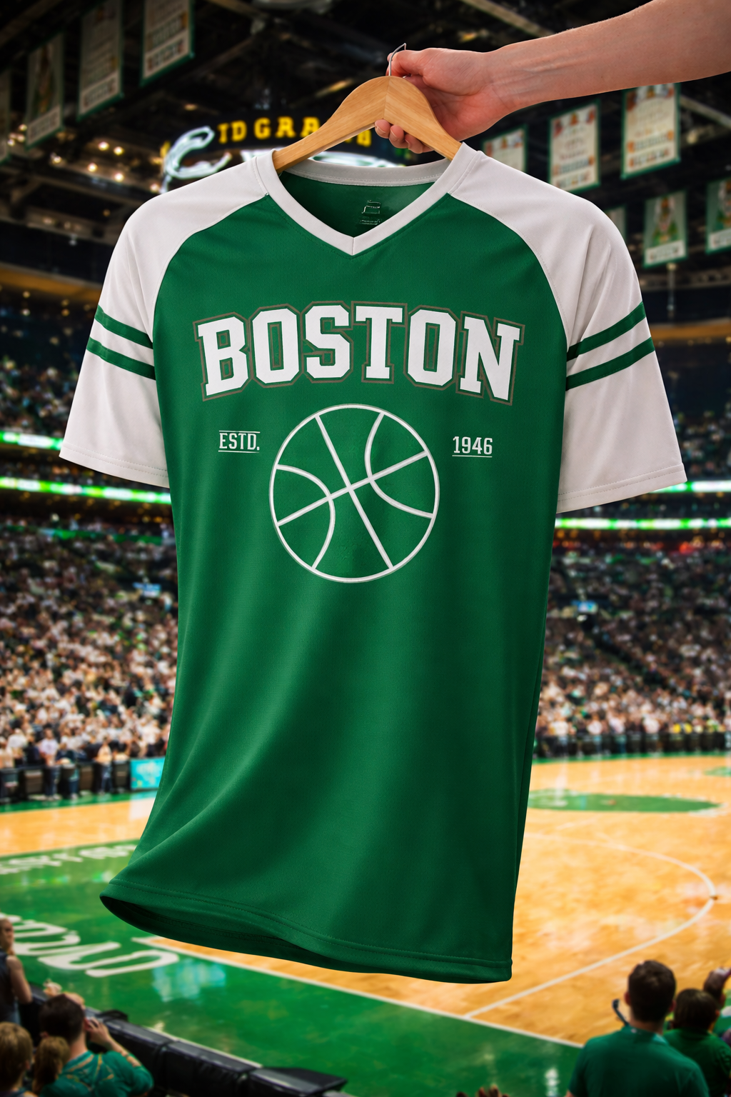 Green and white sports jersey with 'Boston' and basketball design on a hanger against a sports arena background.