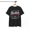 Black t-shirt with 'Boston Champs' text on a hanger against a white background