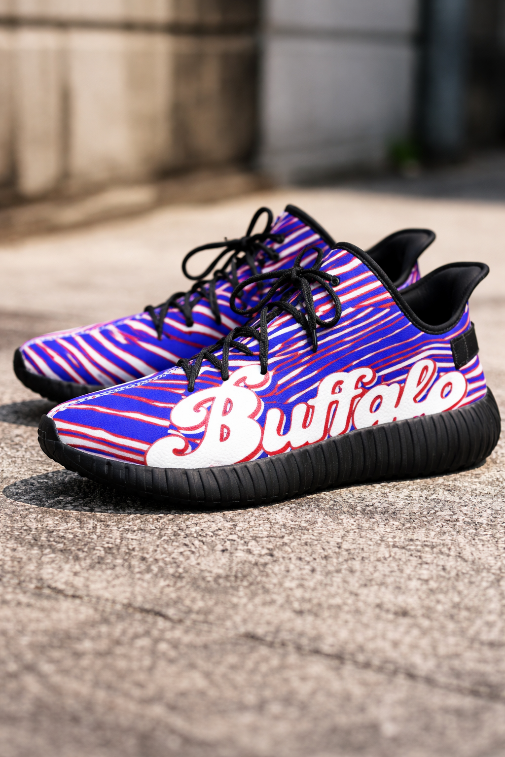 Purple and black striped sneakers with 'Buffalo' branding on a concrete surface.