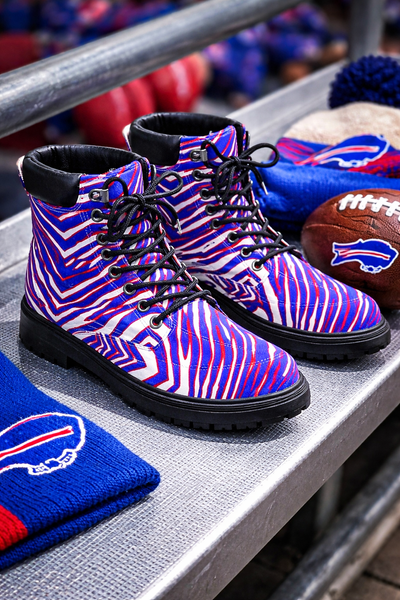 Zebra-patterned boots with Buffalo Bills logo on a sports-themed surface