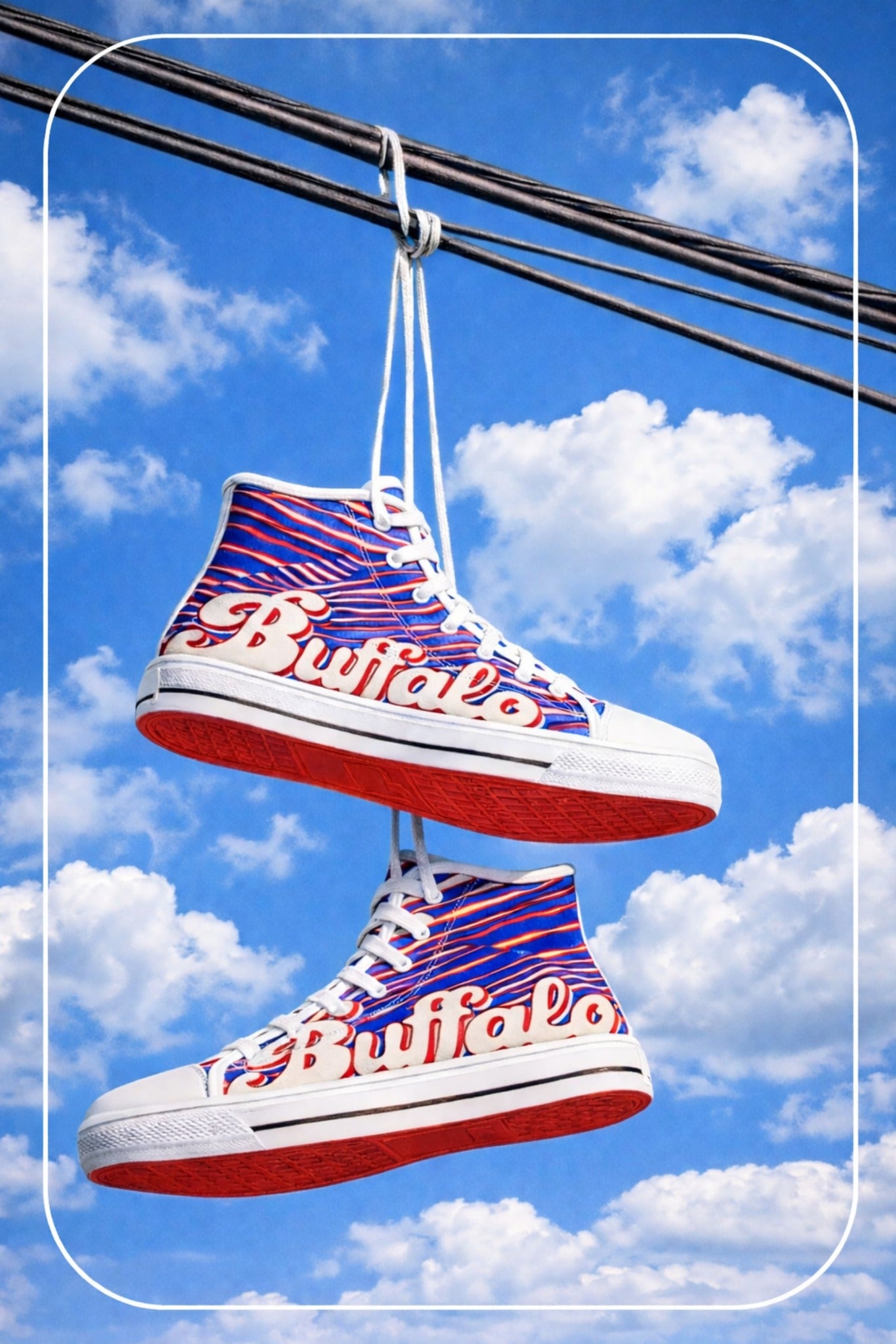 Colorful high-top sneakers with 'Buffalo' text hanging against a blue sky with clouds.