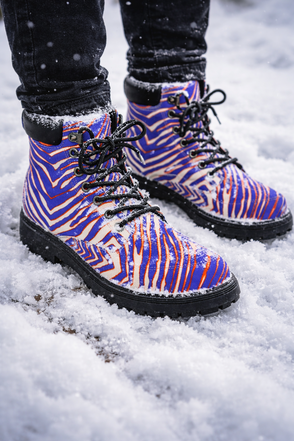Zebra-patterned boots on a snowy ground