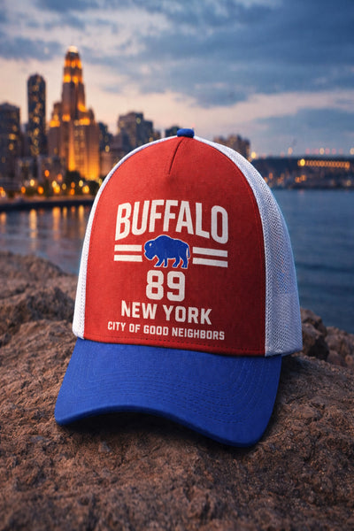 Red and blue cap with 'Buffalo 89 New York' text against a cityscape background