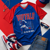 Blue and red sports-themed t-shirt with 'Buffalo' graphic, surrounded by accessories on a colorful background.