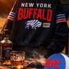 New York Buffalo 1960 jacket with Jack Daniel's whiskey and a cap on a table outdoors.