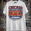 White t-shirt with 'Chicago Football' design on a hanger against an urban background