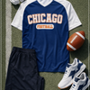 Chicago football-themed shirt with shorts, sneakers, and a football on a grass field.