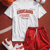 White t-shirt with 'Chicago Hoops' design, red shorts, white sneakers, basketball, and headphones on a red surface.