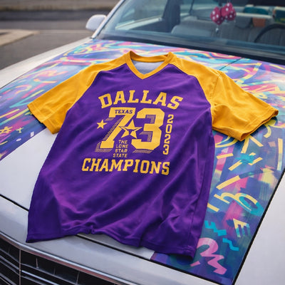 Purple and yellow sports jersey with 'Dallas Texas Champions' text on a colorful car hood.