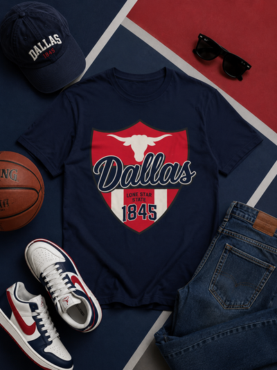 Navy t-shirt with 'Dallas' design, cap, sneakers, basketball, and sunglasses on a sports-themed background.