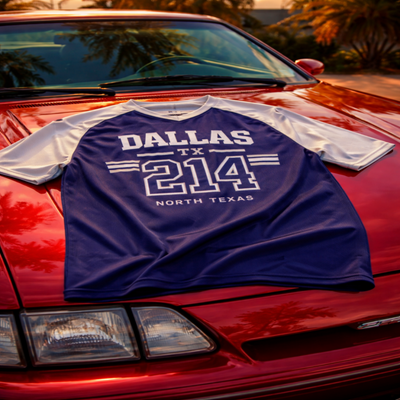 Blue and white shirt with 'Dallas TX 214 North Texas' text on a red car