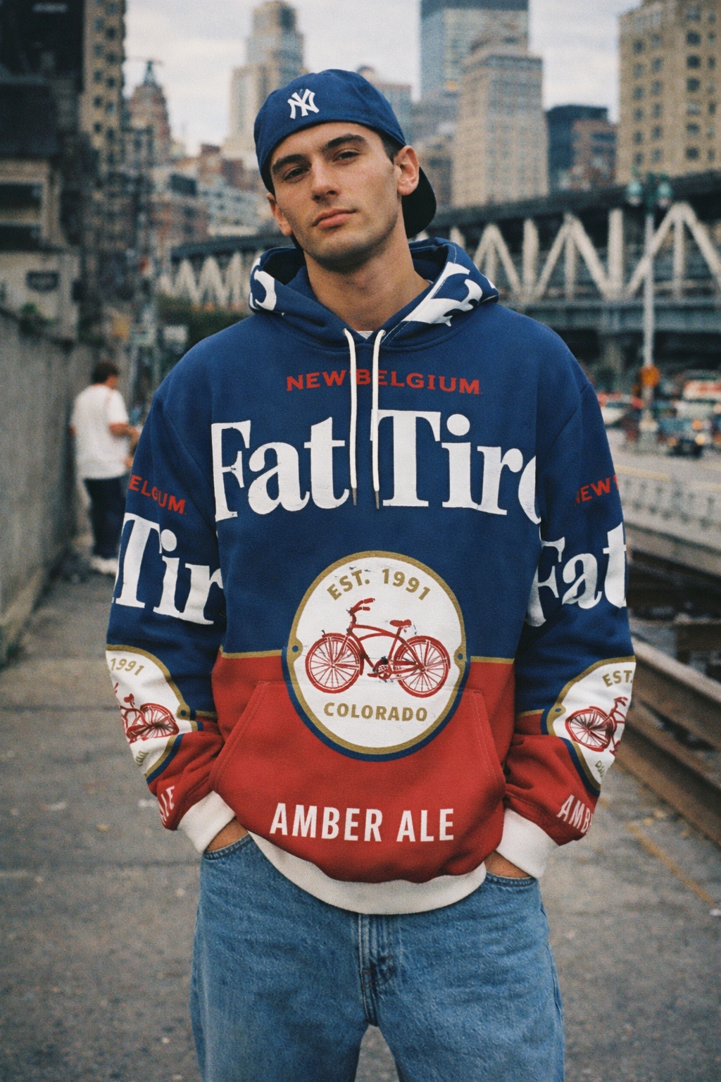 Person wearing a Fat Tire Amber Ale hoodie in an urban setting