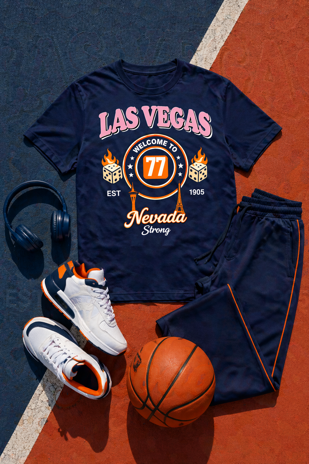 Navy blue t-shirt with 'Las Vegas Nevada Strong' design on a basketball court, with shorts, sneakers, and a basketball.