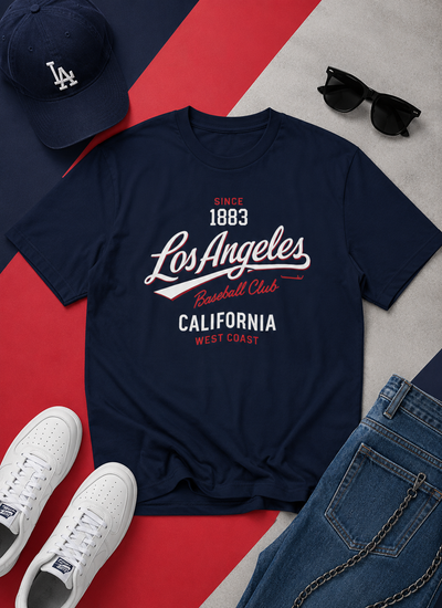 Navy blue t-shirt with 'Los Angeles Baseball Club' text, surrounded by a cap, sunglasses, and sneakers on a red and gray background.