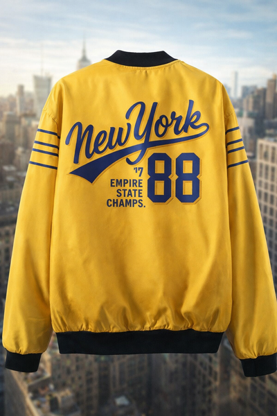 Yellow jacket with 'New York 88 Empire State Champs' text against a cityscape background