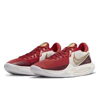 Red basketball shoes with white soles and gold accents on a white background