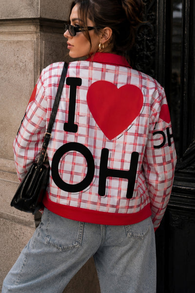 Person wearing a plaid jacket with 'I ❤️ OH' text and red heart design.