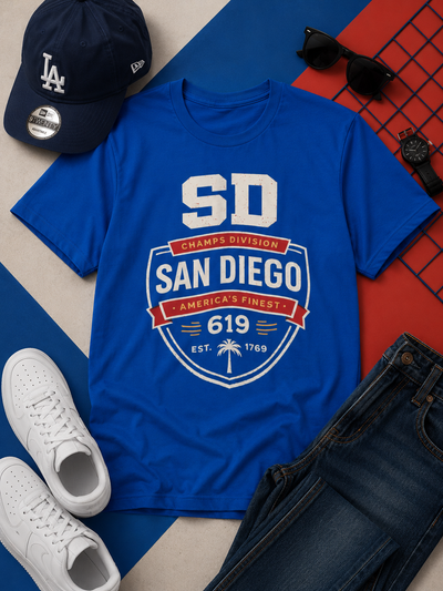 Blue t-shirt with 'San Diego' design, LA Dodgers cap, sunglasses, and white sneakers on a colorful background.