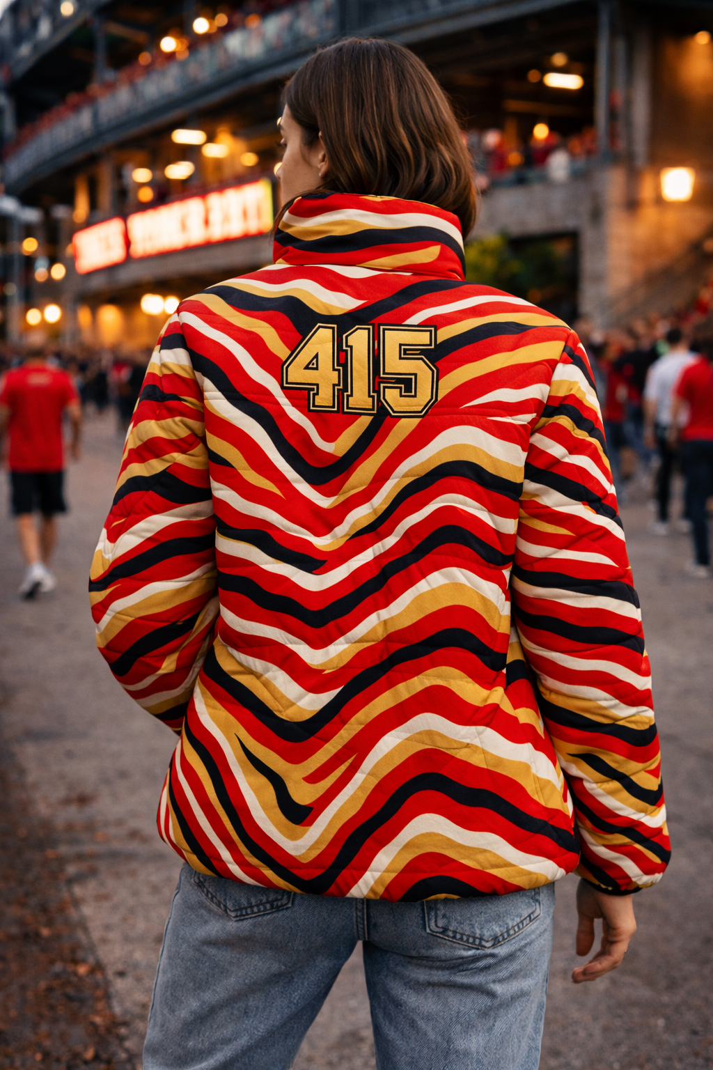 Person wearing a colorful striped jacket with '415' on the back in an urban setting.