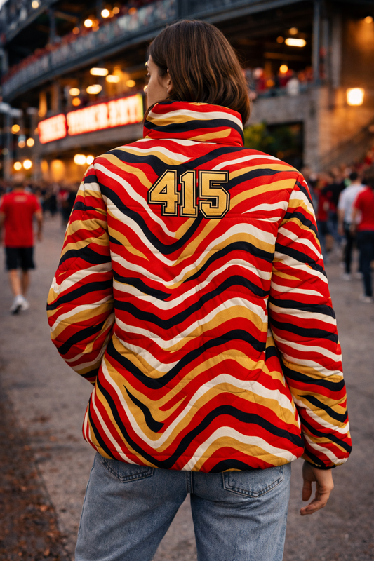 Person wearing a colorful striped jacket with '415' on the back in an urban setting.