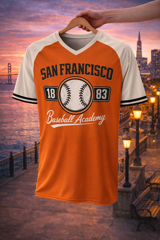 Orange and white baseball jersey with 'San Francisco Baseball Academy' text against a cityscape background.