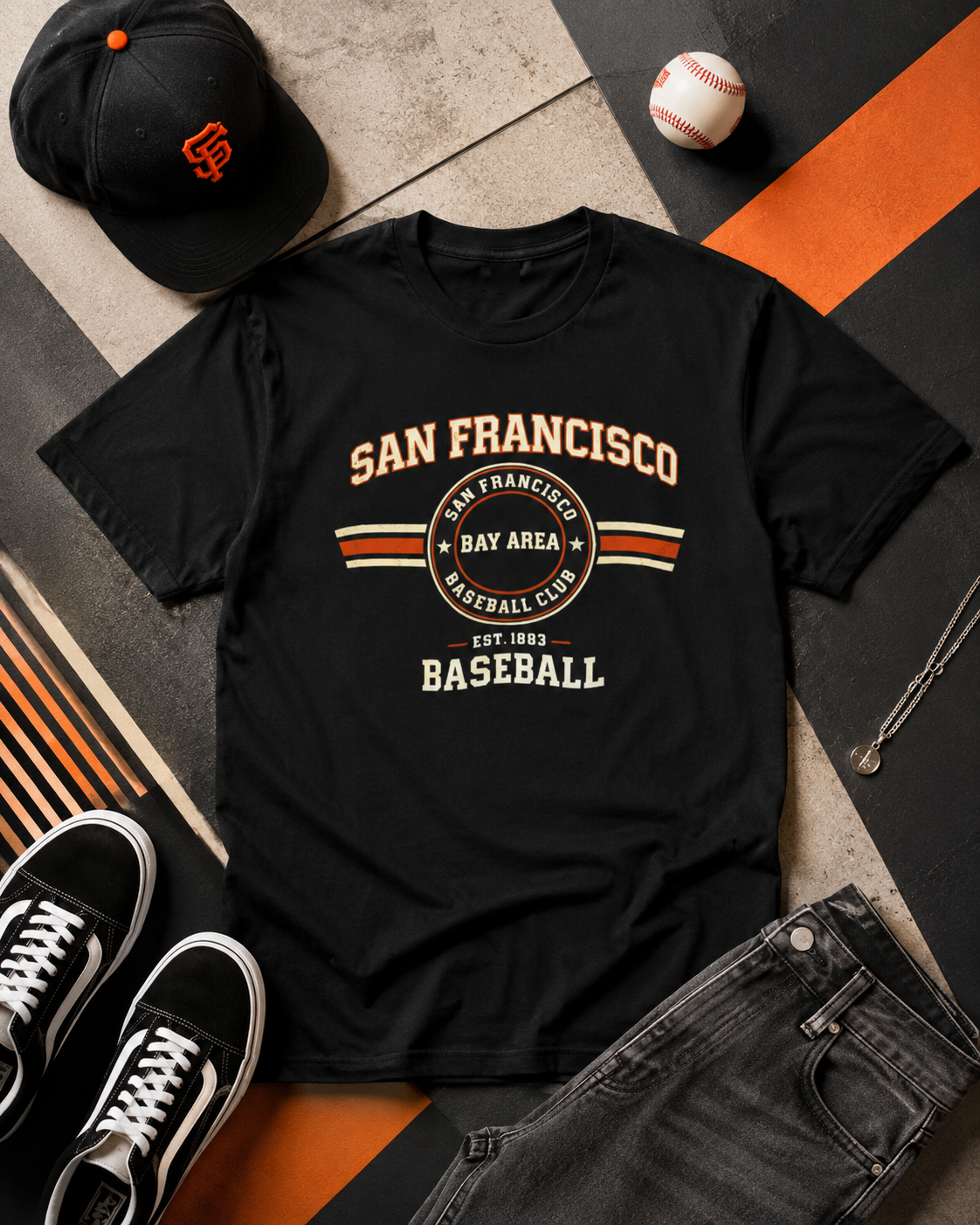 Black t-shirt with 'San Francisco Baseball Club' design, surrounded by a cap, sneakers, and a baseball on a patterned surface.