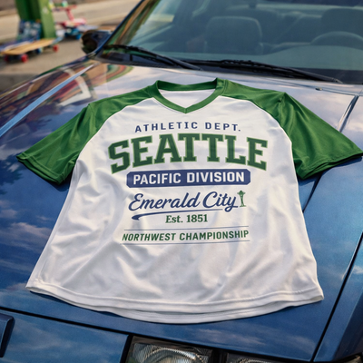 White and green sports jersey with 'Seattle' text on a blue car hood