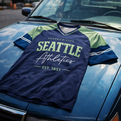 Navy and green sports jersey with 'Seattle Athletics' text on a car hood