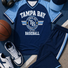 Navy and light blue sports outfit with 'Tampa Bay' branding on a sports-themed surface.