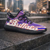 Colorful sneaker with 'Buffalo' branding on a cityscape background