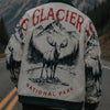 Person wearing a jacket with Glacier National Park design on a mountain road
