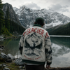 Person wearing a Glacier National Park jacket with a mountain and lake in the background